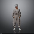 Elderly Person With White Hair Standing In Light Gray Jumpsuit Hands In Pockets White Shoes