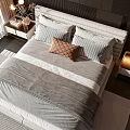 Double Bed With Gray White Bedding Striped Pillows Brown Cushion And Bedside Tables