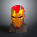 Detailed Damaged Iron Man Helmet With Red And Gold Design On Brown Base Gray Background