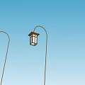 Classic Lantern Style Outdoor Lights Mounted On Curved Poles Against Blue Sky