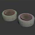 Pair of Round Concrete Manhole Covers With Detailed Decorative Surface Patterns