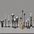 Decorative Candle Lamps With Various Black Holders And White Lit Unlit Candles