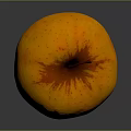 Fresh Ripe Orange Apple With Red Speckles And Stem On Dark Surface