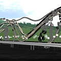 Modern Garden Landscape With Curved Metal Sculptures Green Lawn Pathway And Lighting
