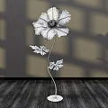 Floral Art Installation Featuring Blue Flower Metal Stem Decorative Leaves Shadow Effect On Wooden Floor