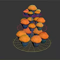 Three Tiered Transparent Glass Cupcake Stand Holding Multiple Orange Cupcakes