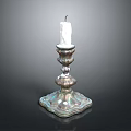 Decorative Metallic Candle Holder With White Candle And Ornate Base Design