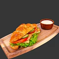 Tasty Croissant Sandwich With Lettuce Tomato Cucumber Ham And Cheese On Wooden Tray With Sauce