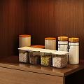 Spice Jars on Wooden Shelf with Transparent Containers and Wooden Lids Storing Various Spices