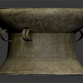 Vintage Brass Colored Drum Shaped Furniture Stool With Textured Surface And Decorative Handles