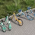 Colorful Bicycles Parked On Brick Paved Ground With Green Grass And Palm Trees