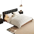Double Bed with Black Leather Tufted Headboard White Striped Quilt Wooden Nightstands and Lamp