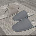 Four Pairs Of Comfortable Home Slippers Light And Dark Gray Soft Fabric On Woven Mat