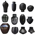 Assorted Dark Toned Ceramic Vessels With Various Shapes And Textured Surfaces