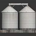 Four White Cylindrical Grain Silos On Gray Platform With Metal Framework