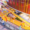 Vibrant Nighttime Commercial Landscape With Neon Signs Multi Level Buildings And Pedestrians