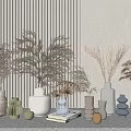 Vases of Various Shapes and Colors with Dried Flowers on Tabletop Against Striped Wall