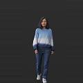 Woman Wearing Blue And White Gradient Sweater With Blue Jeans Standing Against Gray Background