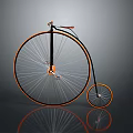 Vintage High Wheel Bicycle With Black And Orange Frame And Spoked Wheels