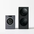 Two Modern Black Household Appliances With Sleek Design And Circular Features