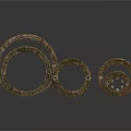 Artistic Bronze Ring Sculptures With Textured Surfaces And Stacked Design