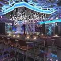 Modern Bar Interior with Neon Lights Colorful Lighting Mirrored Ceiling Bar Counter and Seats