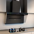 Modern Kitchen With Black Range Hood Gas Stove And Kitchen Appliances