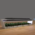 Modern Exhibition Island With White Structure Green Plants And Blue Screen