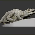 White Stone Dinosaur Sculpture Lying On Mossy White Base With Details