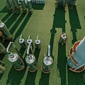 Industrial Factory Featuring Large Metallic Tanks Pipes And Tall Tower Structures