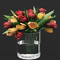 Transparent Glass Vase With Red And Yellow Tulips And Green Leaves