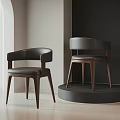 Modern Accent Chairs With Leather Seats Curved Arms And Wooden Legs In Minimalist Room