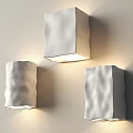 Three White Textured Wall Lamps Mounted On Beige Wall For Illumination