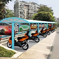 Blue Street Side Shelter Covering Orange Electric Scooters In Residential Area