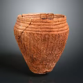 Carved Terracotta Pottery Jar Featuring Textured Surface and Visible Cracks