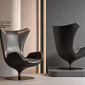 Black Leather Bean Bag Chair With Modern Wingback Design And Metal Base
