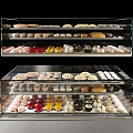 Delicious Assorted Desserts In Glass Display Case With Cupcakes Tarts And Chocolate Treats