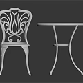 White Ornate Outdoor Furniture Set With Round Table And Carved Chair