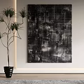 Black and White Abstract Painting Hanging on White Wall with Green Plant
