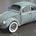 Light Blue Vintage Beetle Car With Curved Body And White Wall Tires