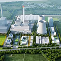 Aerial View of Modern Industrial Plant With Cooling Towers Chimneys Green Spaces and Roads