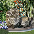 Living Plant Wall Featuring Diverse Green Foliage Orange Flowers And Vibrant Leaves