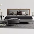 Modern Double Bed with Gray Bedding Maroon Pillows Bedside Tables Stool and Area Rug