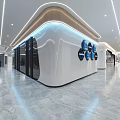 Modern Office Corridor With Curved White Walls Recessed Lighting Glass Partitions And Marble Flooring