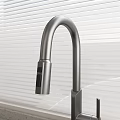 Contemporary Kitchen Sink Featuring Sleek Faucet And Window Blinds On Countertop