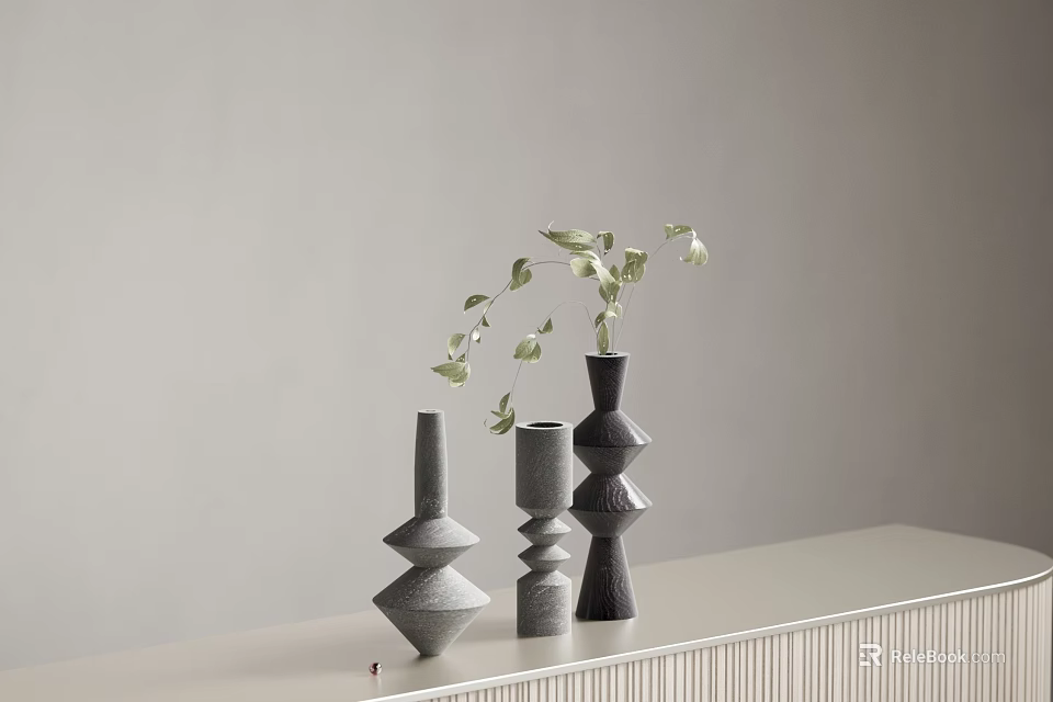 Modern Geometric Vases With Green Foliage On Light Toned Surface 3d model 