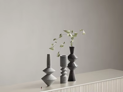 Modern Geometric Vases With Green Foliage On Light Toned Surface 3d model