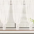 White Curtains With Tie Top Design Against Striped Blinds By Window With Green Plants
