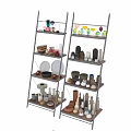 Two Grey Ladder Shelves Displaying Various Colored Shaped Ceramic Vessels On Dark Wall