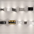 Modern Wall Lamps With Various Geometric Shapes And Black Gold White Colors On White Wall